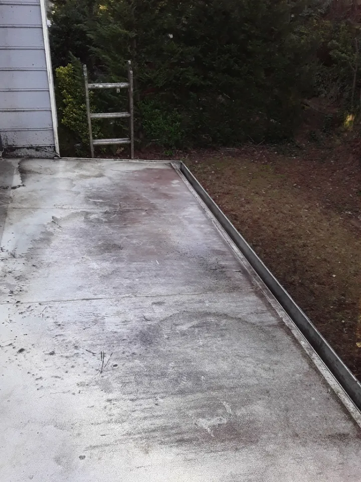 Commercial flat roof cleared of loose debris after removal