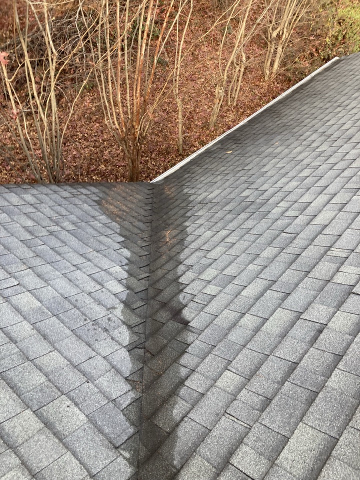 Roof valley cleared of fallen leaves after cleanup